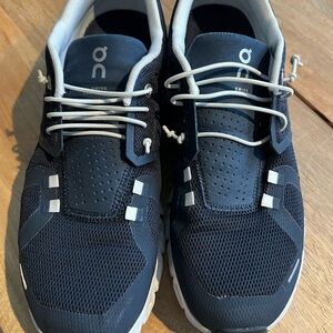 On Running Navy and White Athletic Shoes with Unique Lacing System